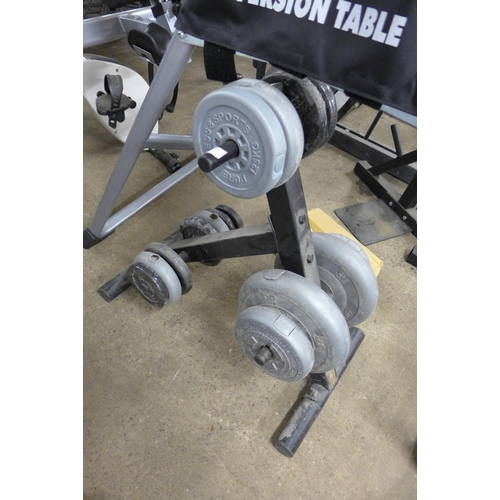 2396 - 16 Assorted dumbbell/barbell weights on body solid stand