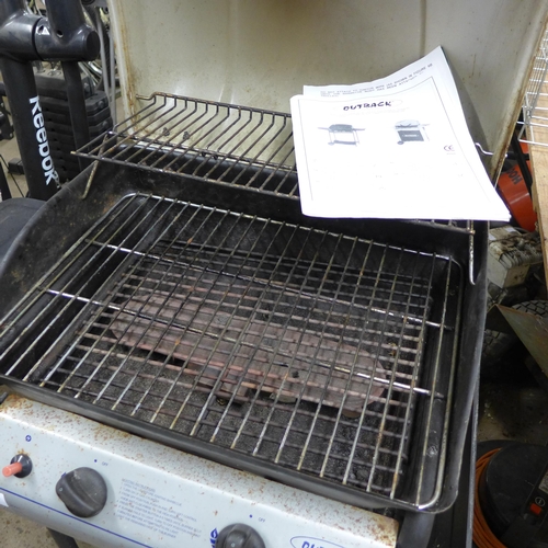 2401 - Outback Omega II gas-powered barbecue and sack of BBQ coals