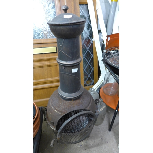 2419 - Cast iron chimenea/garden stove and approx 15 vinyl planters