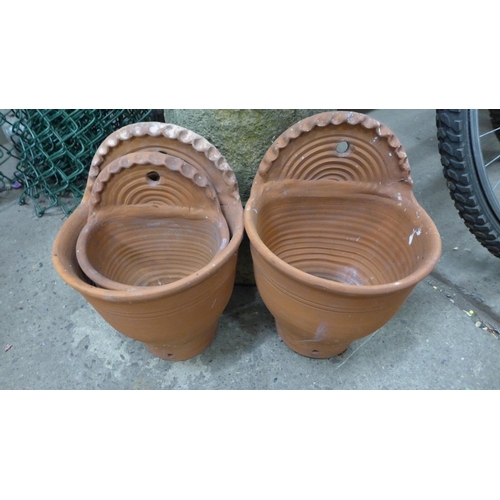 2431 - Crown chimney pot and three terracotta wall pots