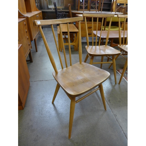 70 - A set of four Ercol Blonde elm and beech 608 model dining chairs