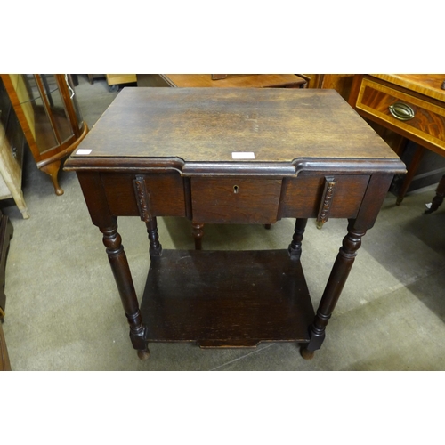 144 - An Art Deco oak side table