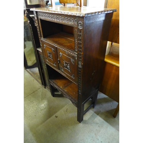 170 - An early 20th Century carved oak side cabinet