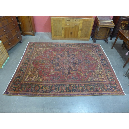 192 - An Iranian red ground Tabriz rug, 277 x 225cms