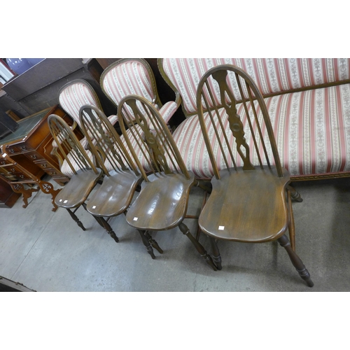 114 - A set of elm and beech Windsor style kitchen chairs