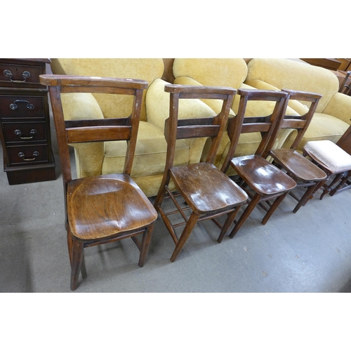 119 - A set of four early 20th Century elm elm and beech chapel chairs