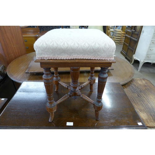 122 - A Victorian mahogany revolving piano stool