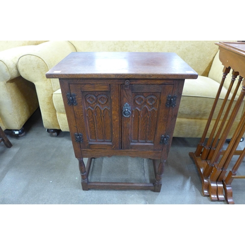 123 - A small 17th Century style carved oak cupboard