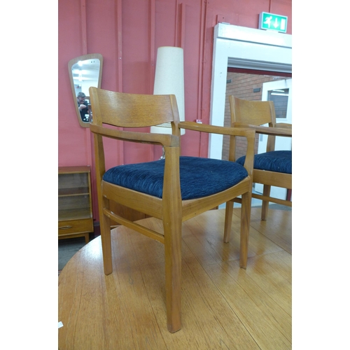 14 - A Nathan teak extending dining table and six chairs