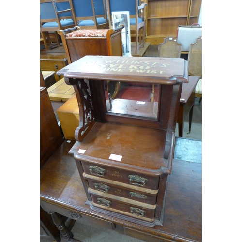 148 - A mahogany counter top haberdashery shop cabinet, bearing Dewhursts Sylko inscription