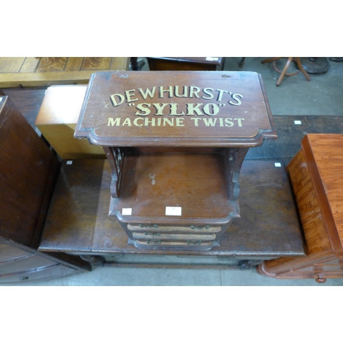 148 - A mahogany counter top haberdashery shop cabinet, bearing Dewhursts Sylko inscription