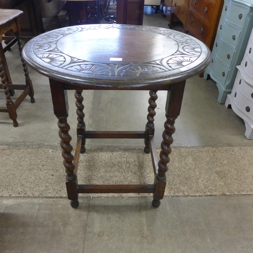 160 - A circular oak barleytwist occasional table