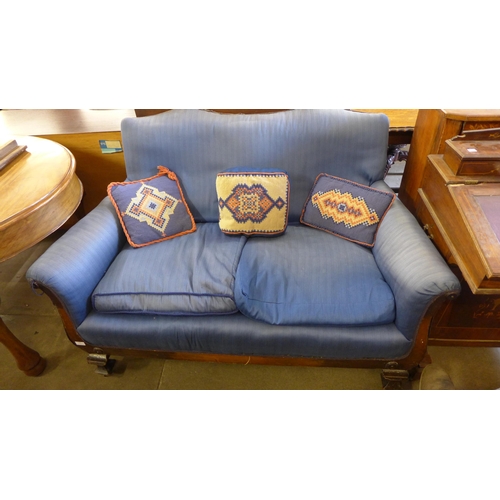 168 - A Victorian mahogany and blue fabric upholstered scroll arm settee