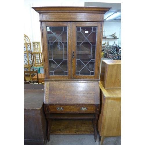 172 - An Edward VII inlaid oak bureau bookcase