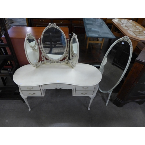 178 - A French style cream and parcel gilt dressing table and a cheval mirror