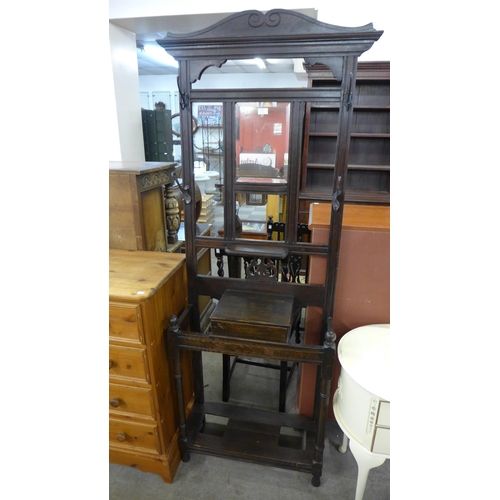 180 - An early 20th Century oak hallstand