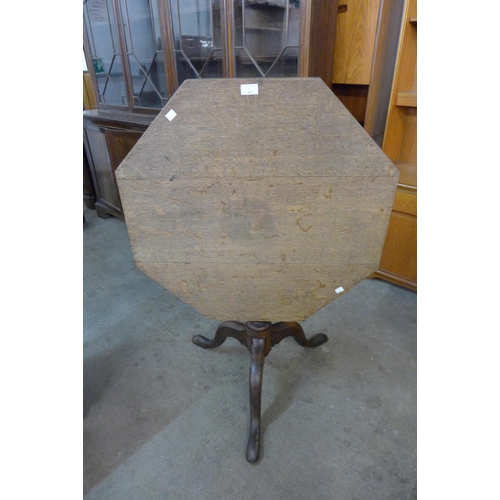 189 - A George III oak octagonal tilt-top tripod tea table