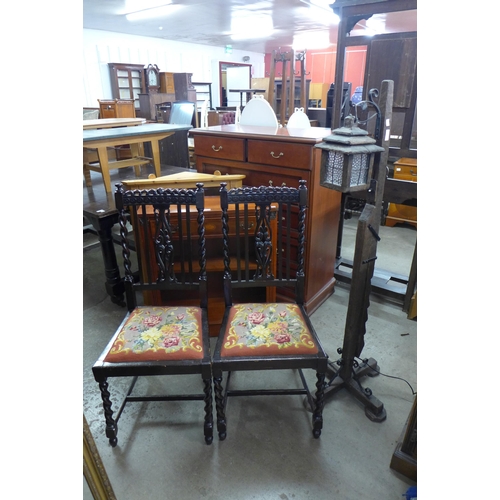 201 - A pair of oak barleytwist side chairs and a lantern style standard lamp