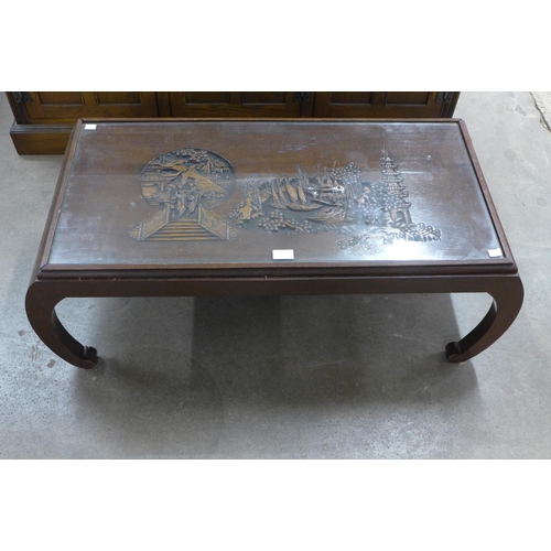 202 - An oriental carved wood opium table