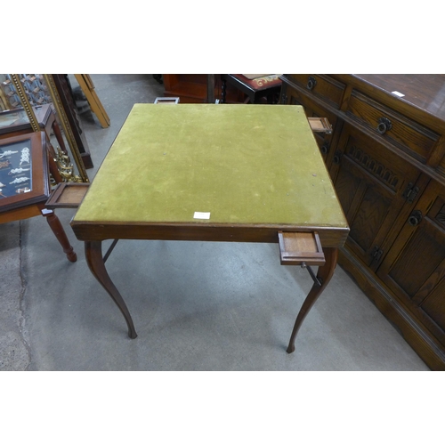 212 - An early 20th Century folding games table