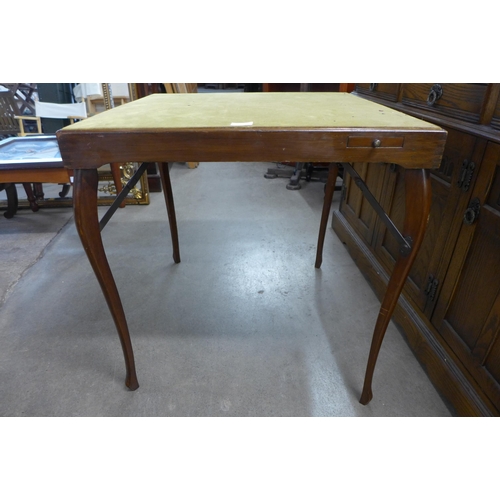 212 - An early 20th Century folding games table