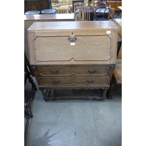 214 - An oak bureau and a child's desk