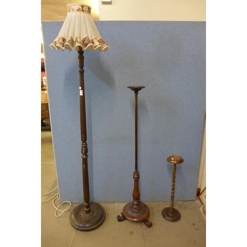 215 - A Victorian carved rosewood pole, a beech smokers stand and a beech standard lamp