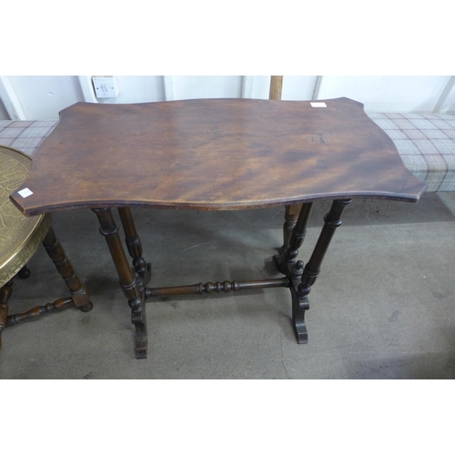 223 - A brass topped folding table and a mahogany stretcher table