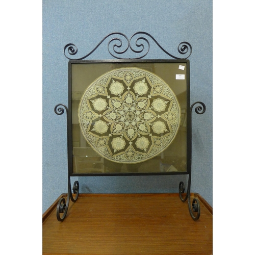 266 - A wrought iron fire screen