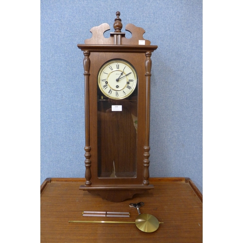 268 - A Hermle mahogany wall clock