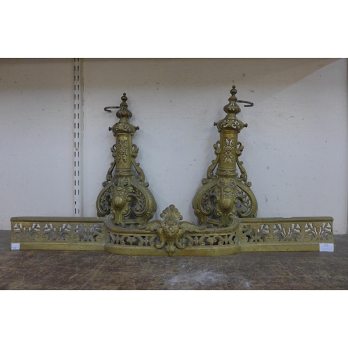 272 - A French brass fender and pair of andirons