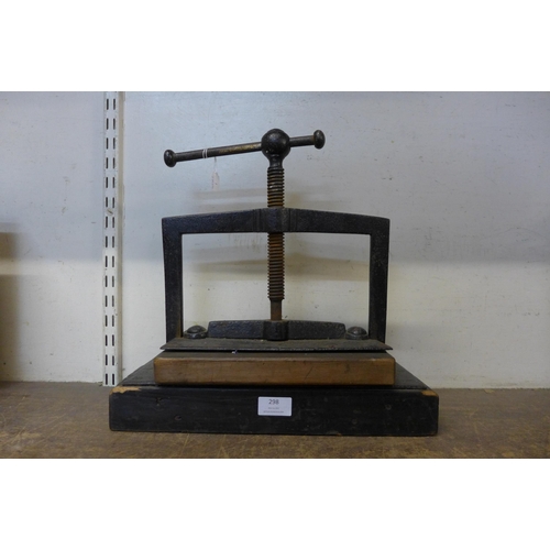 298 - A cast iron book press