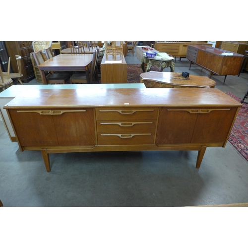 32 - A teak sideboard