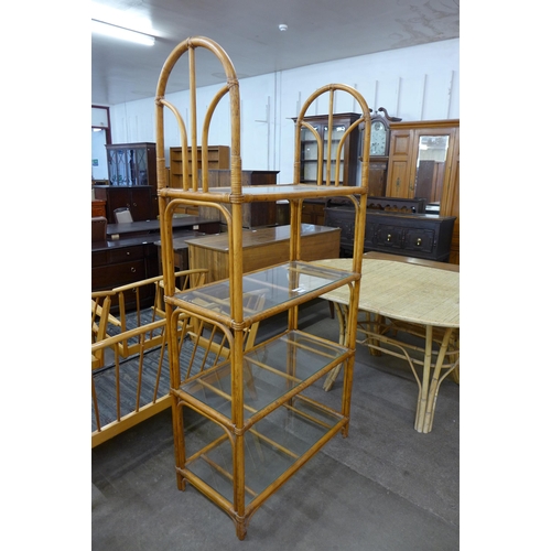 39 - A bamboo and glass shelved four tier whatnot a revolving chair