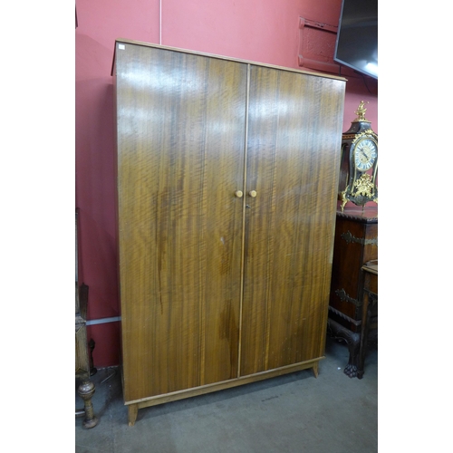 45 - A Heals afromosia two piece bedroom suite, comprising; two door wardrobe and chest of drawers