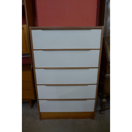 46 - A teak and white laminate chest of drawers