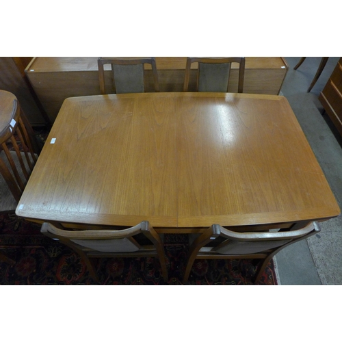 57 - A Nathan teak extending dining table and four chairs