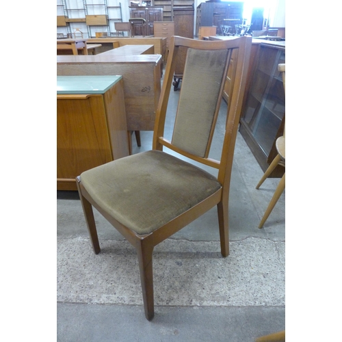 57 - A Nathan teak extending dining table and four chairs