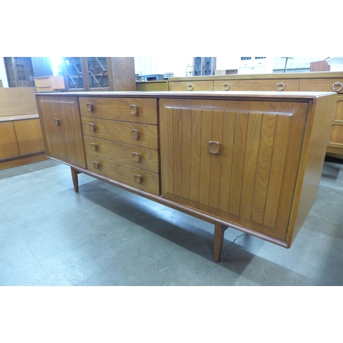 63 - An Ensign teak and elm sideboard, by Bristow & Townsend