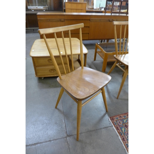 70 - A set of four Ercol Blonde elm and beech 608 model dining chairs