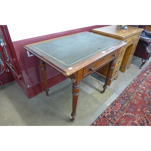 84 - A Victorian mahogany and green leather topped single drawer writing table