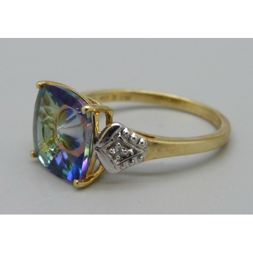 1024 - A 9ct gold quasar cut topaz and diamond ring, signed Lehrer, with certificate, 2.9g, N