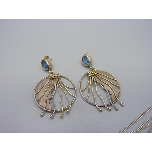 1026 - A pair of silver earrings set with topaz and a 925 silver pendant set with blue, red and one other s... 