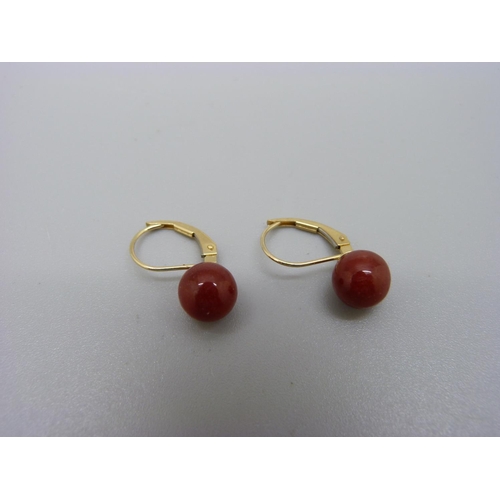 1030 - A pair of 14ct gold set earrings