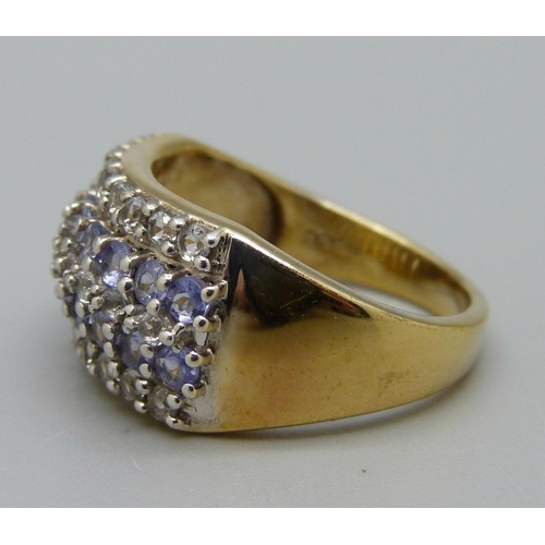 1035 - A silver gilt, tanzanite and white stone ring, O