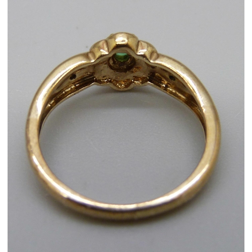 1039 - A 9ct gold, emerald and diamond ring, 2.1g, L