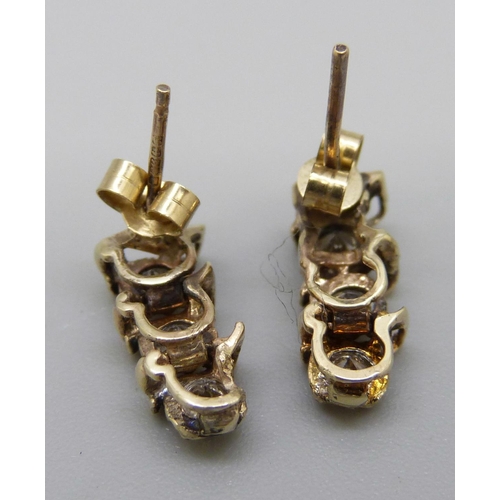 1040 - A pair of 9ct gold and diamond earrings, approximately 1.25ct diamond weight