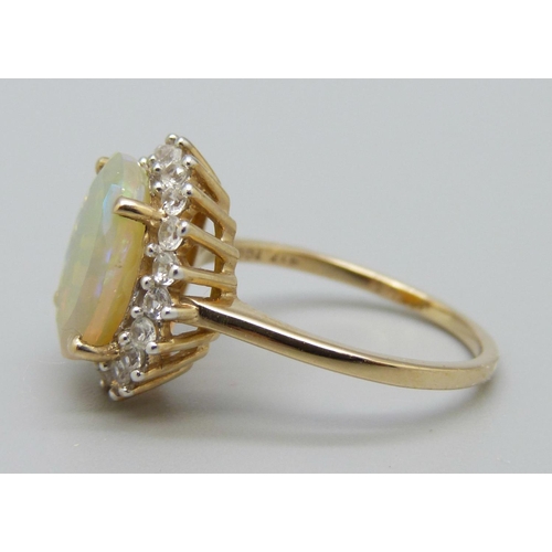 1044 - A 9ct gold, Ethiopian opal and zircon ring, O, with certificate