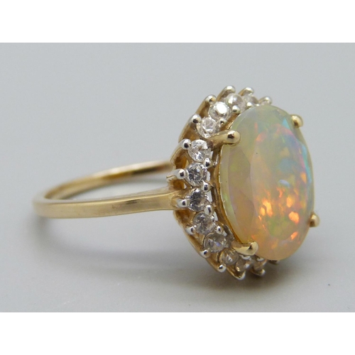 1044 - A 9ct gold, Ethiopian opal and zircon ring, O, with certificate