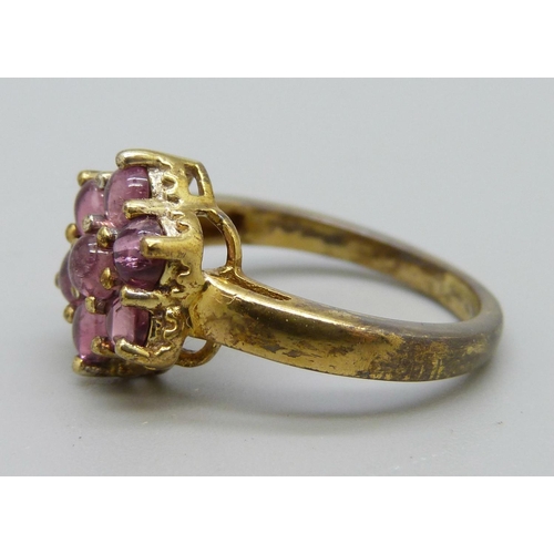 1045 - A silver gilt and pink tourmaline ring, N, with certificate, gilt worn